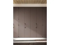 Swing door wardrobe, central doors with panel opening. Interior in cotton, doors and handles in clay.