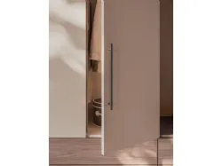 Swing door wardrobe with Smooth door, Cotton interior, drawers and open element in textured Walnut.