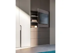 Swing wardrobe with smooth door, TV visual element with drawers in matte Titanium and Tufo finish.