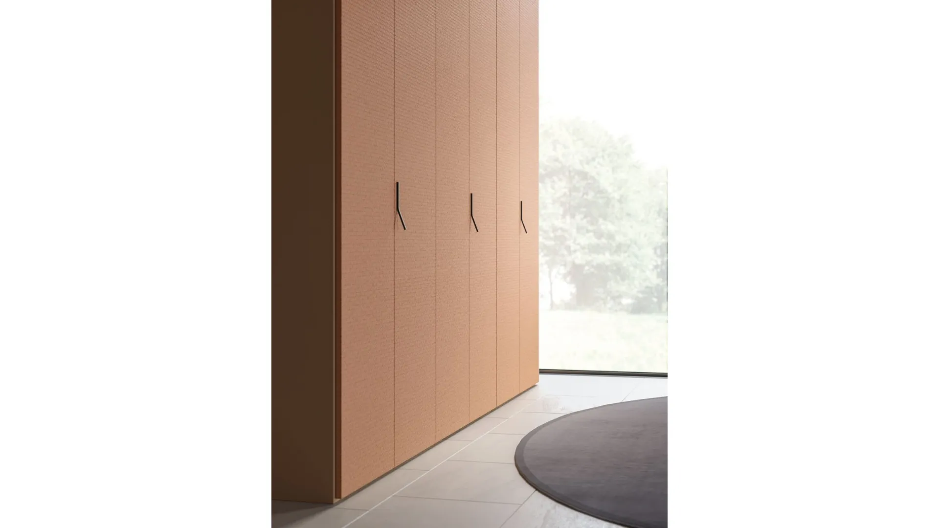 Swing door wardrobe with smooth door, interior in oak, doors in matte lacquered copper.