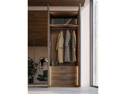 Hinged wardrobe with Noto door. Interior in terracotta, doors in terracotta materic and bronze mirror.