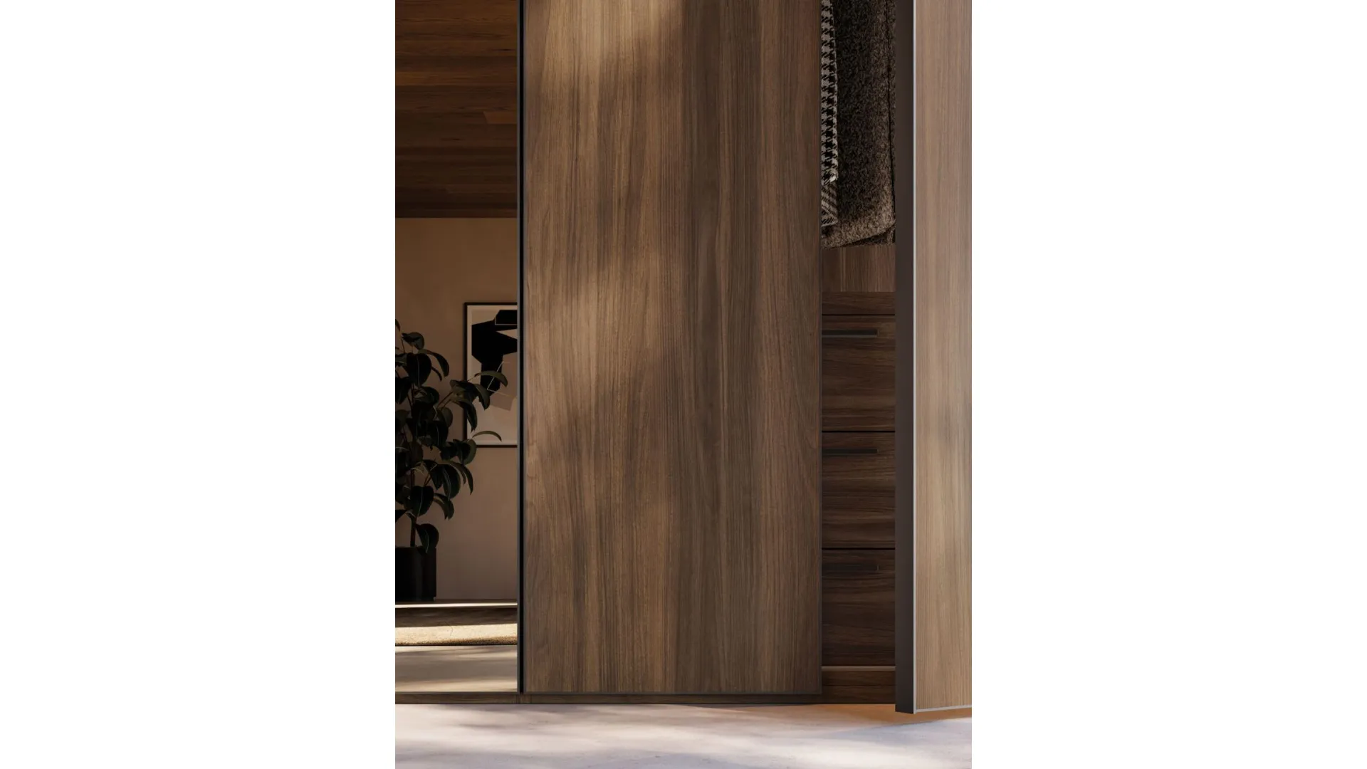 Sliding door wardrobe with Noto door. Interior in terracotta, doors in terracotta material and bronzed mirror.