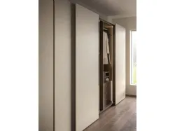 Sliding wardrobe with Arka door. Interior in terracotta, doors in Avana melamine décor.