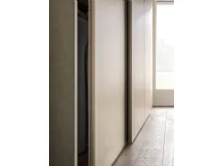 Sliding wardrobe with Arka door. Interior in terracotta, Avana melamine décor doors.