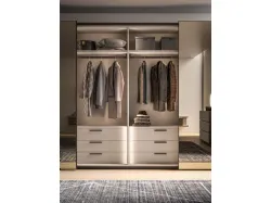 Sliding wardrobe with internal Cotton, doors in matte lacquered Clay and bronzed mirror.