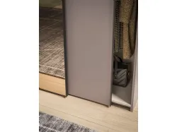 Sliding wardrobe with internal Cotton finishing, doors in matte lacquered Clay and bronzed mirror.