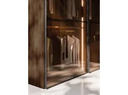 Sliding wardrobe with Frame door. Interior in terracotta, Frame doors in bronzed glass and burnished metal.