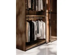 Sliding wardrobe with Frame door. Interior in terracotta, Frame doors in bronzed glass and burnished metal.