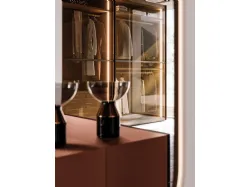 Sliding wardrobe with Frame door. Interior in terracotta, Frame doors in bronzed glass and burnished metal.