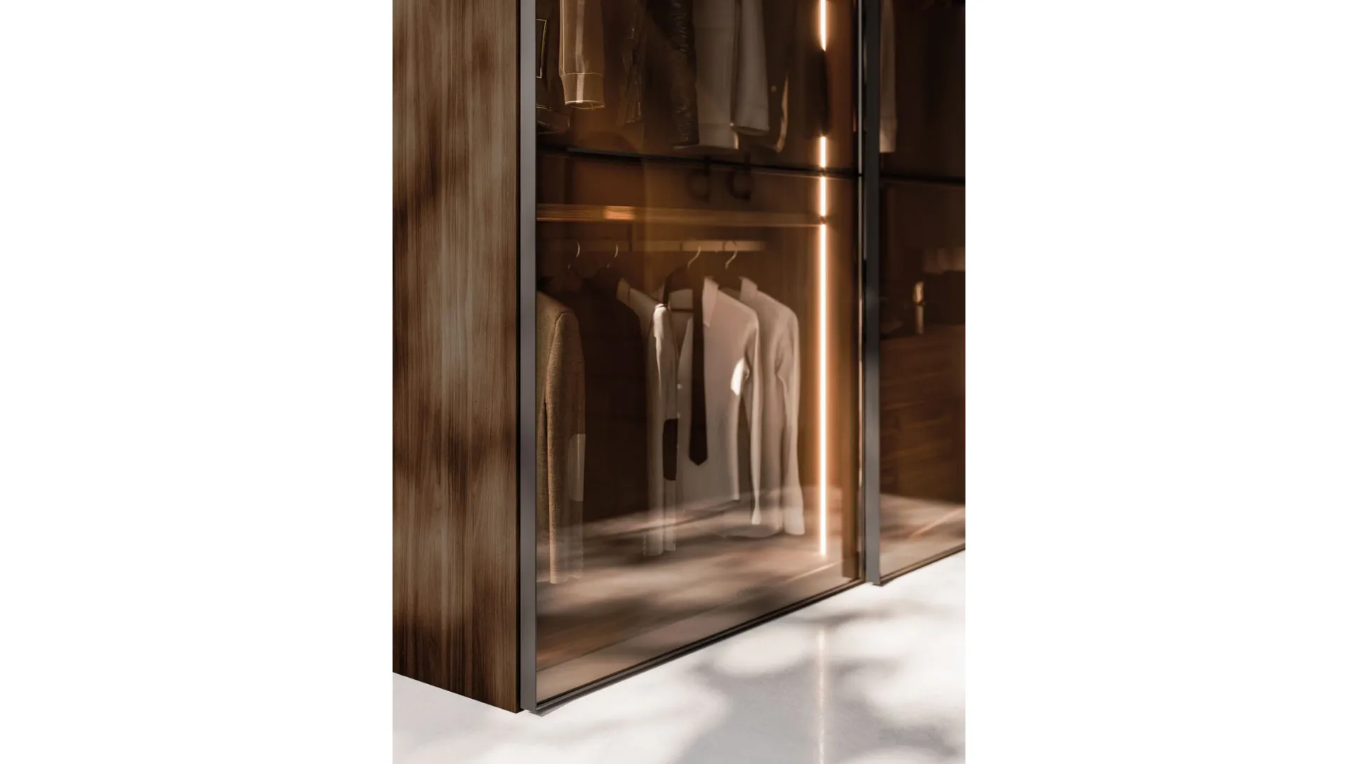 Sliding wardrobe with Frame door. Interior in terracotta, Frame doors in bronzed glass and burnished metal.