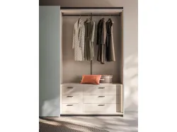 Sliding wardrobe internal in Cotton, doors and Groove handles in matt lead lacquer.