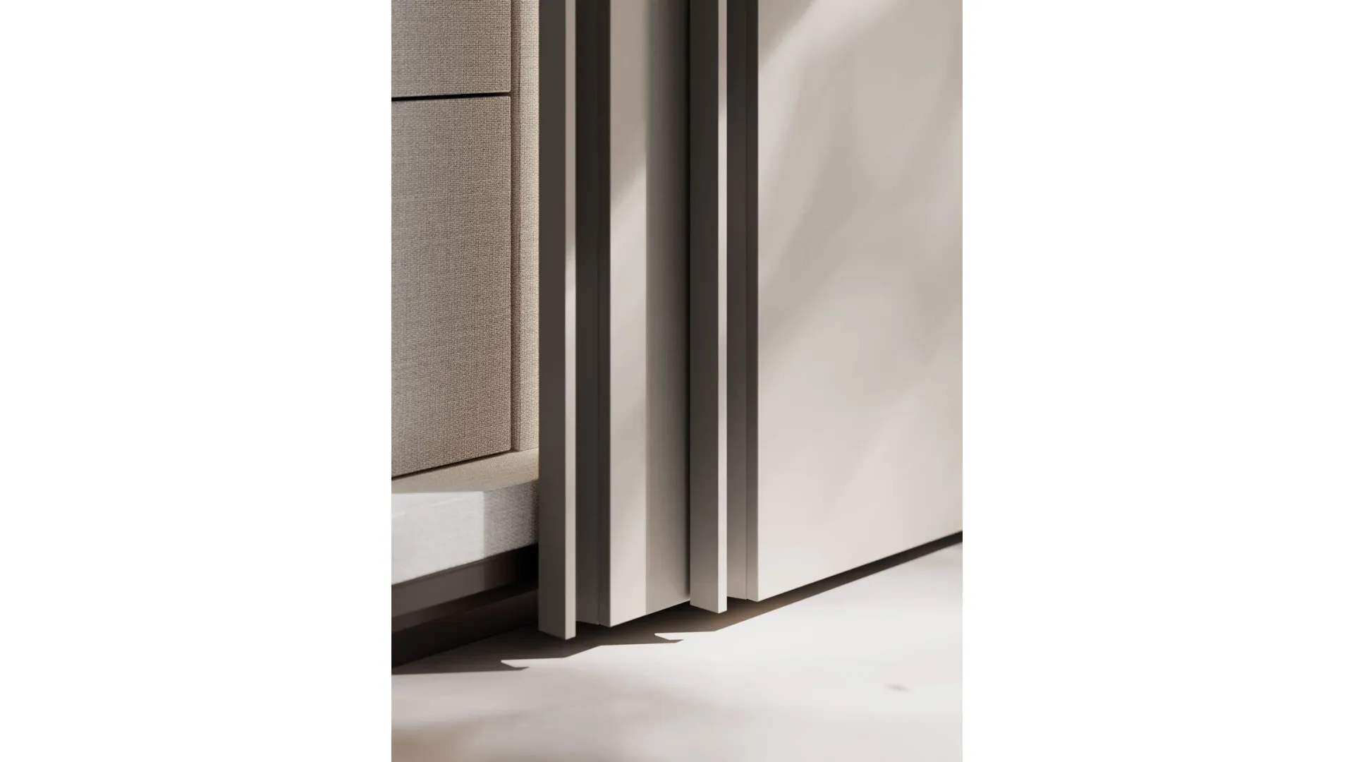 Sliding wardrobe with Gola door. Interior in cotton, doors and Gola handles in matt lacquered titanium.