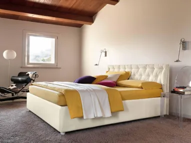 Double bed with upholstered headboard and quilted Smart cushion with storage box.