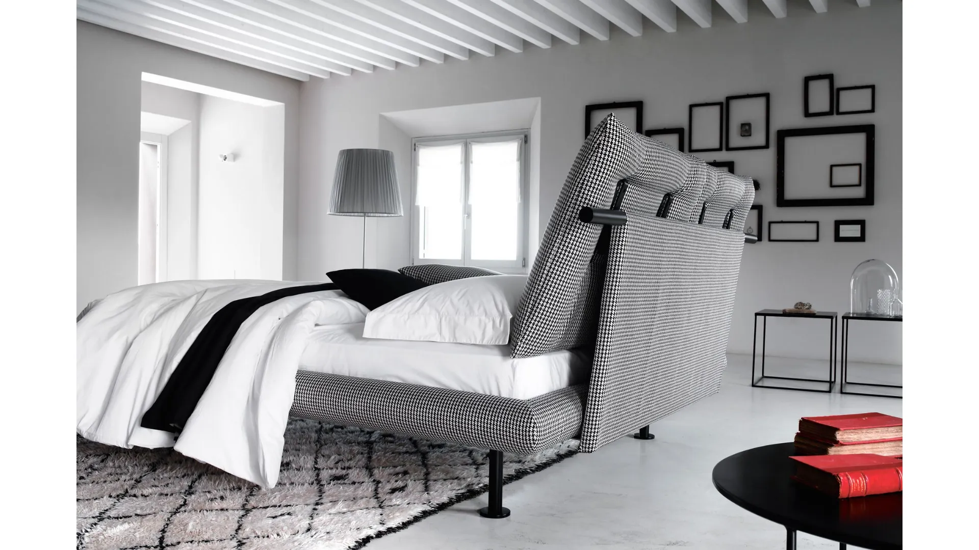 Spacious matrimonial bed of Noah with soft cushions on the headboard.