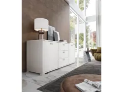 Modern sideboard with two doors, three central drawers, and a large surface area.