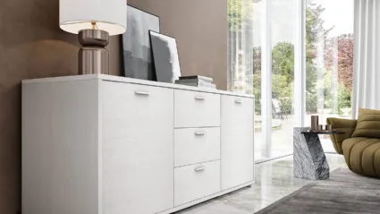 Modern sideboard with two doors, three central drawers, and a large surface area.