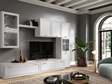 Modern wall unit with glass cabinets, drawers with handles, and TV stand element.