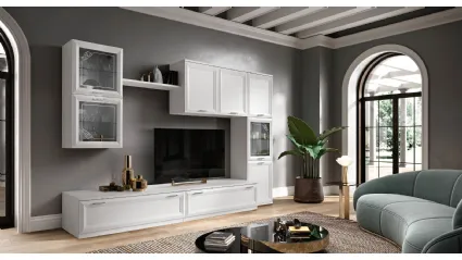 Modern wall unit with glass cabinets, drawers with handles, and TV stand element.