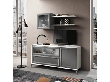 Living room complete with sideboard, wall cabinets and a TV area with shelves.